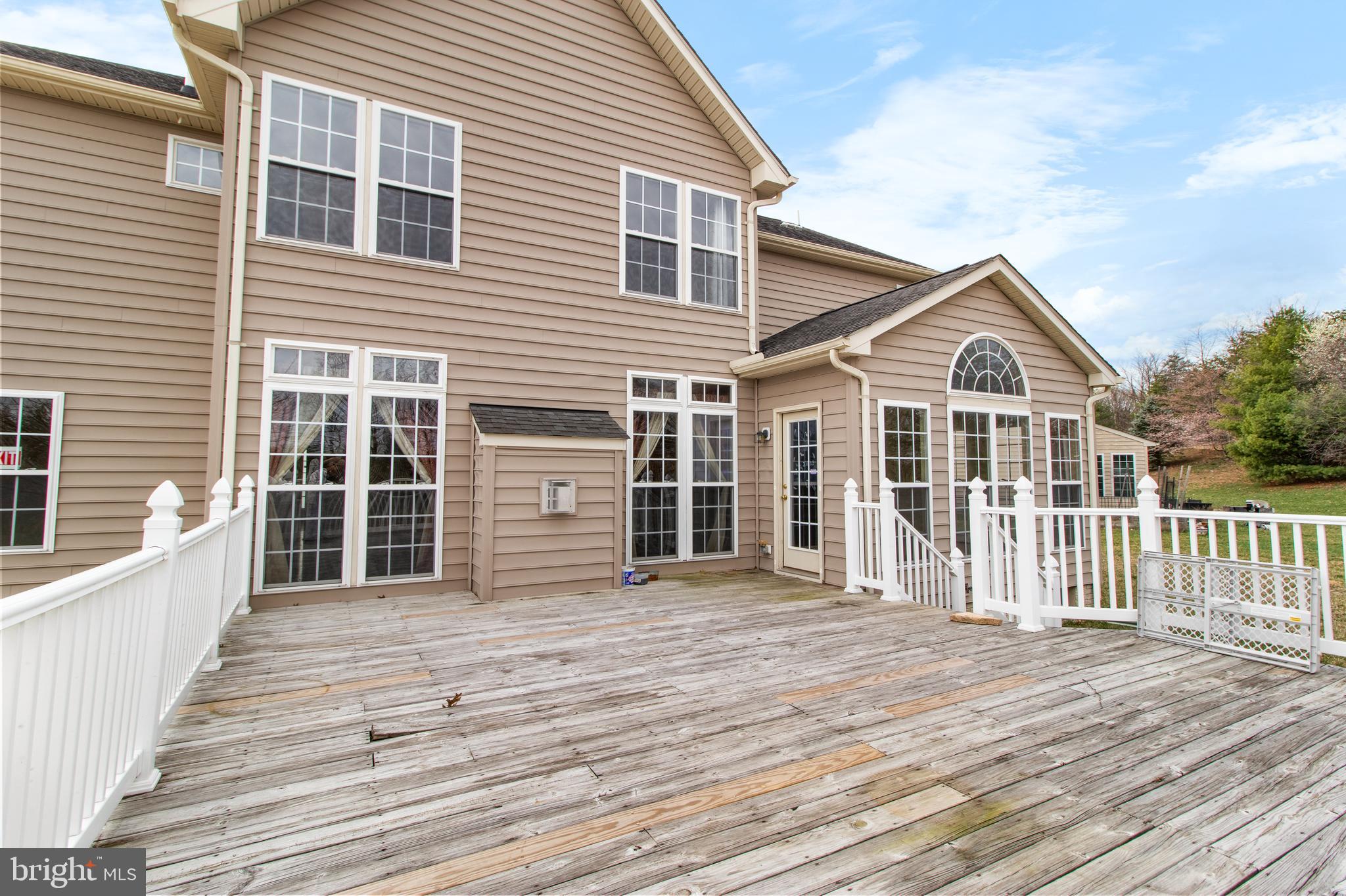 14107 Mintlaw Landing Laurel, MD 20707 - Photo 60 of 63 a view of a house with wooden deck