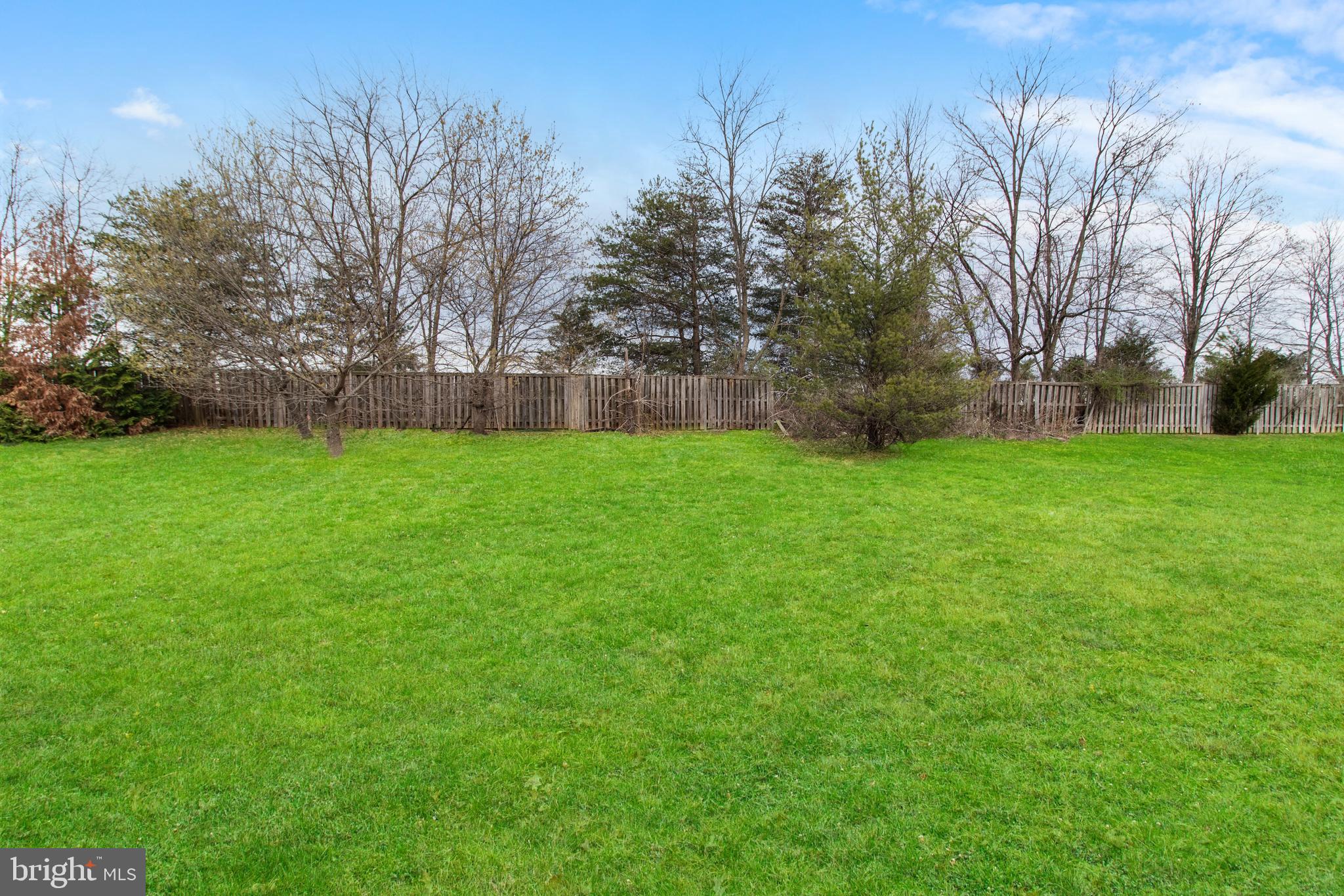 14107 Mintlaw Landing Laurel, MD 20707 - Photo 61 of 63 a view of a field of grass and trees