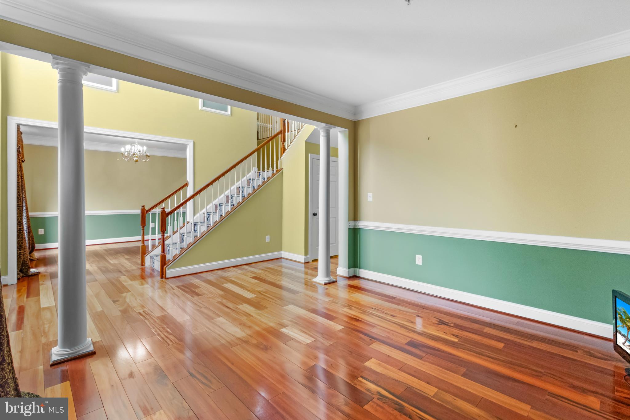 14107 Mintlaw Landing Laurel, MD 20707 - Photo 7 of 63 a view of an empty room with wooden floor