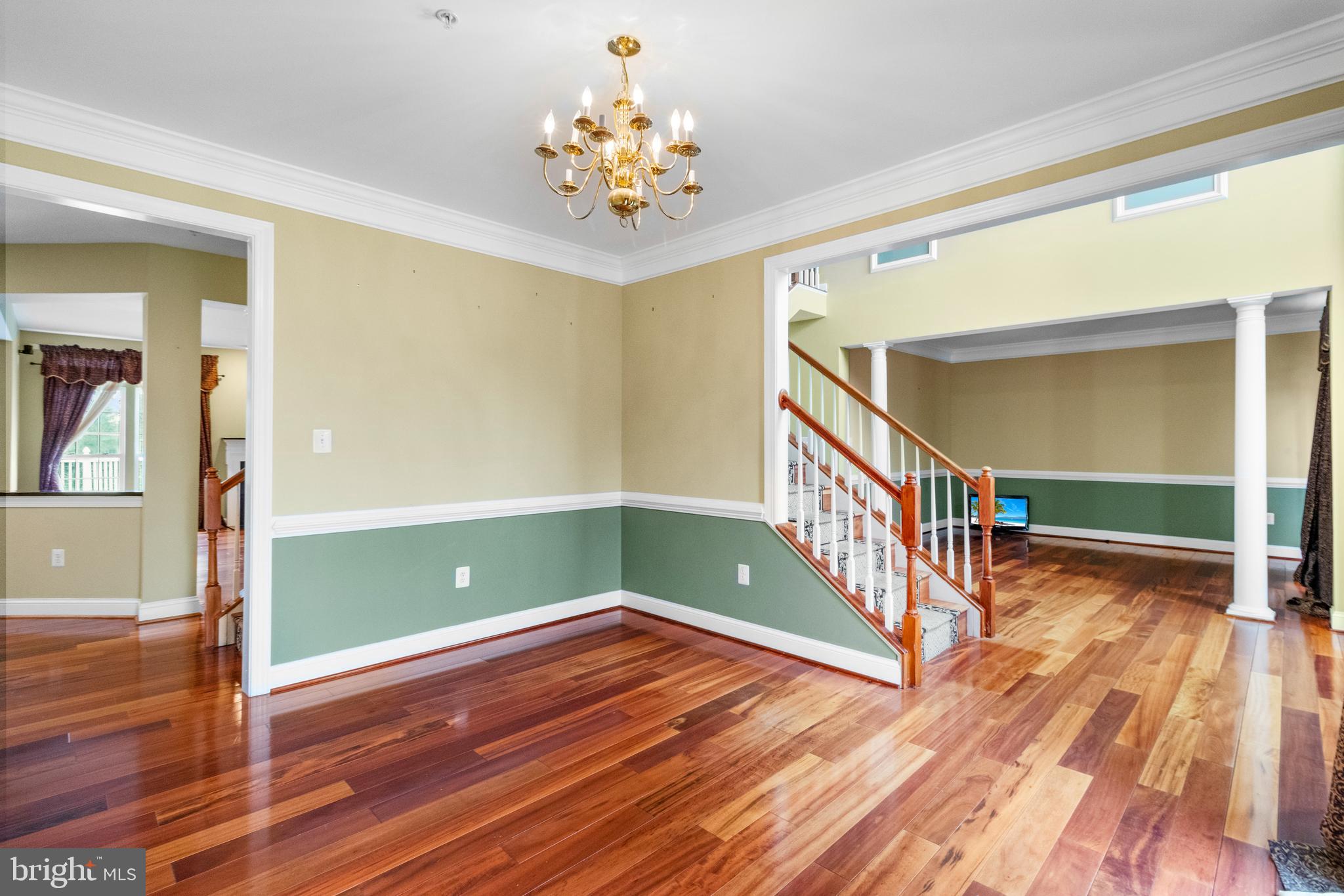 14107 Mintlaw Landing Laurel, MD 20707 - Photo 10 of 63 a view of a livingroom with wooden floor and stairs