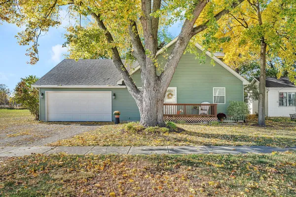 a house that has a tree in front of it