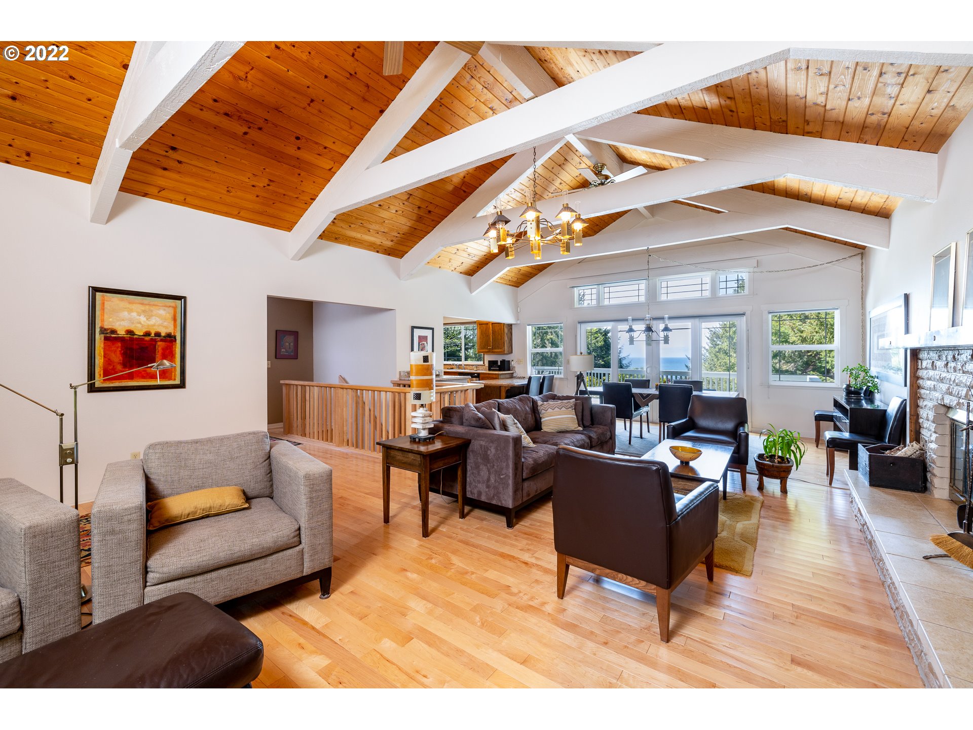 3096 Northeast East Line Road Yachats, OR 97498 - Photo 11 of 30 a living room with furniture kitchen view and a large window