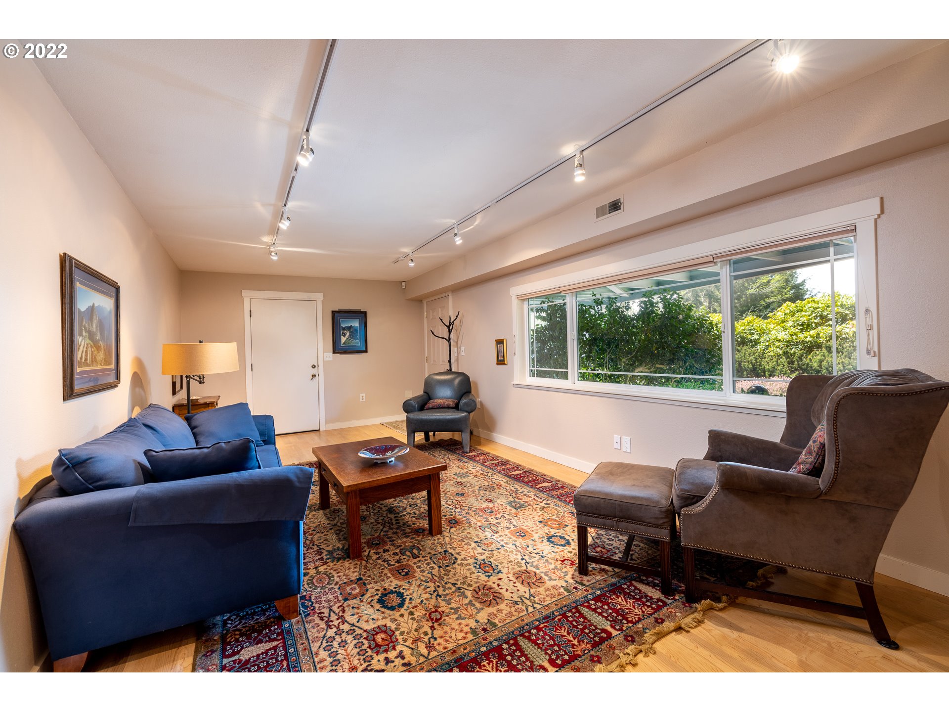 3096 Northeast East Line Road Yachats, OR 97498 - Photo 22 of 30 a living room with furniture and a large window