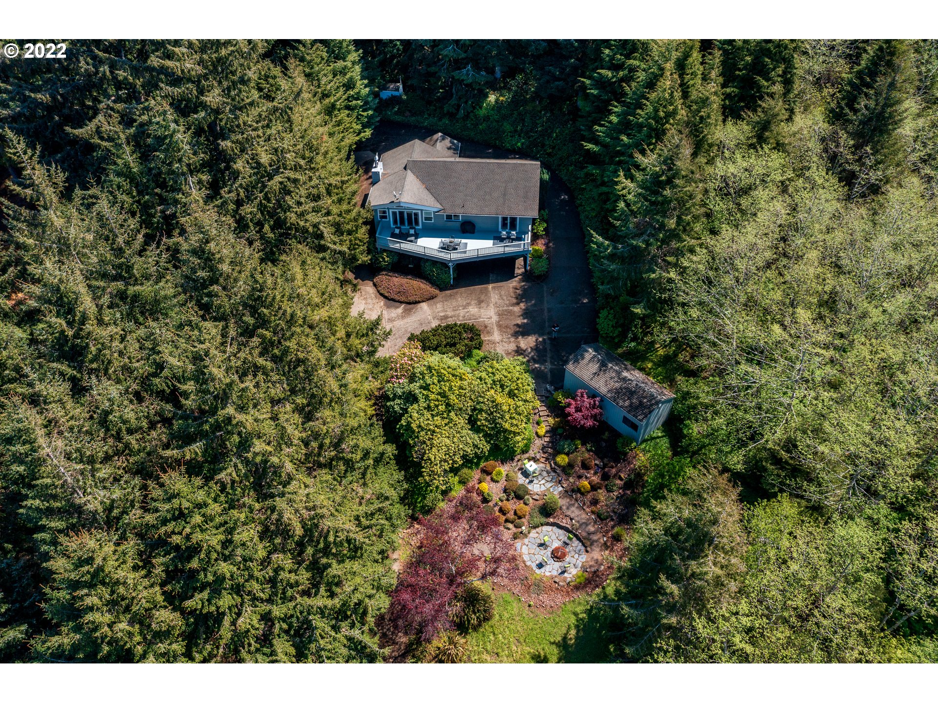 3096 Northeast East Line Road Yachats, OR 97498 - Photo 29 of 30 a aerial view of a house with a yard and garden