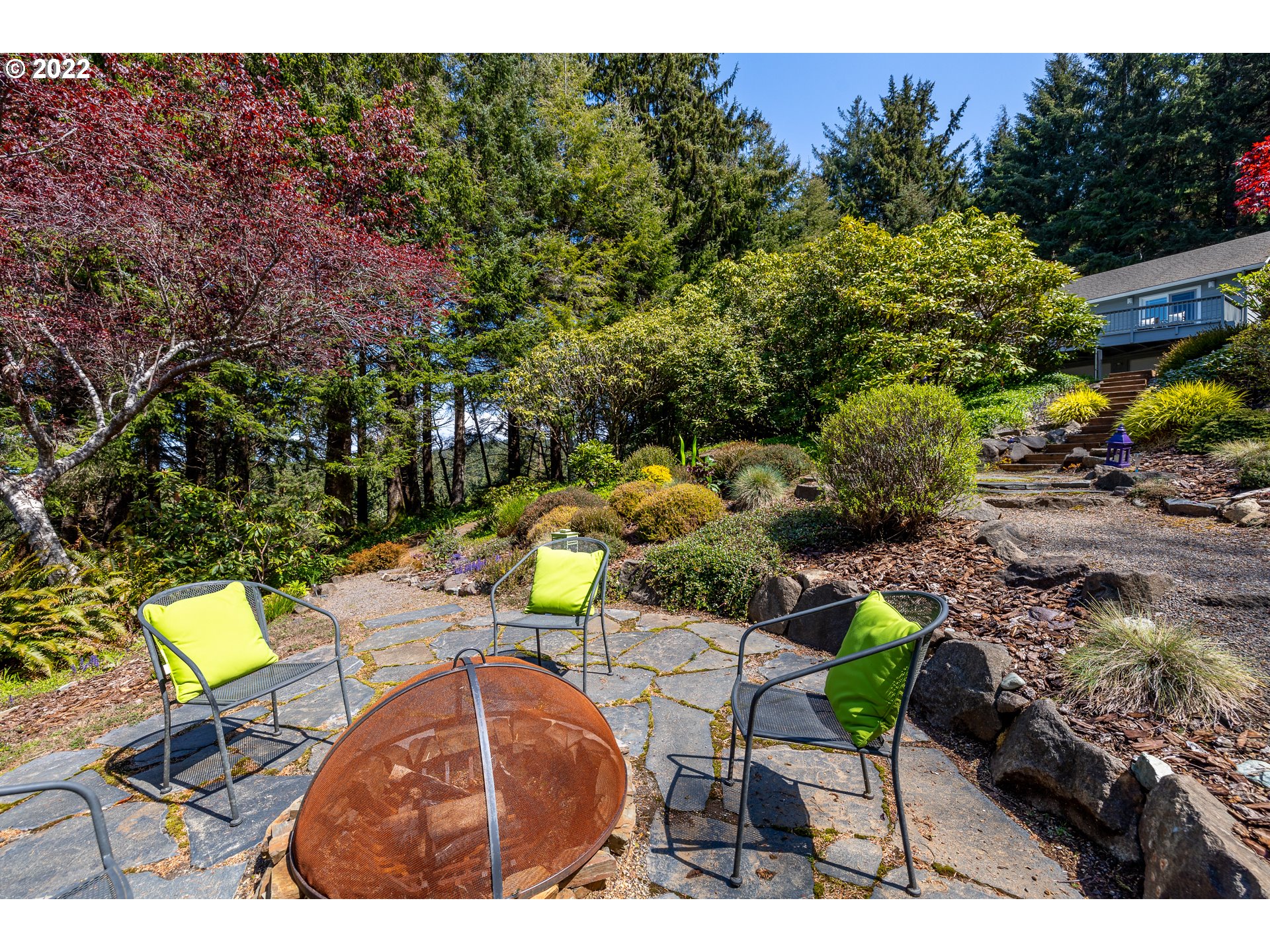 3096 Northeast East Line Road Yachats, OR 97498 - Photo 4 of 30 a view of outdoor dining space with a patio and a yard