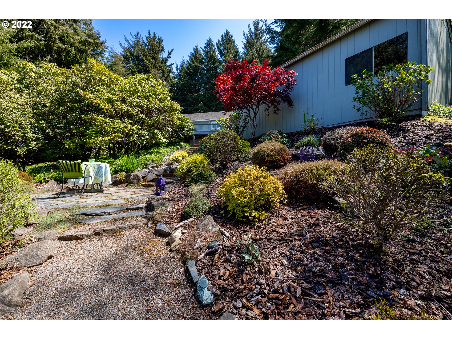 3096 Northeast East Line Road Yachats, OR 97498 - Photo 5 of 30 a view of a backyard with a garden
