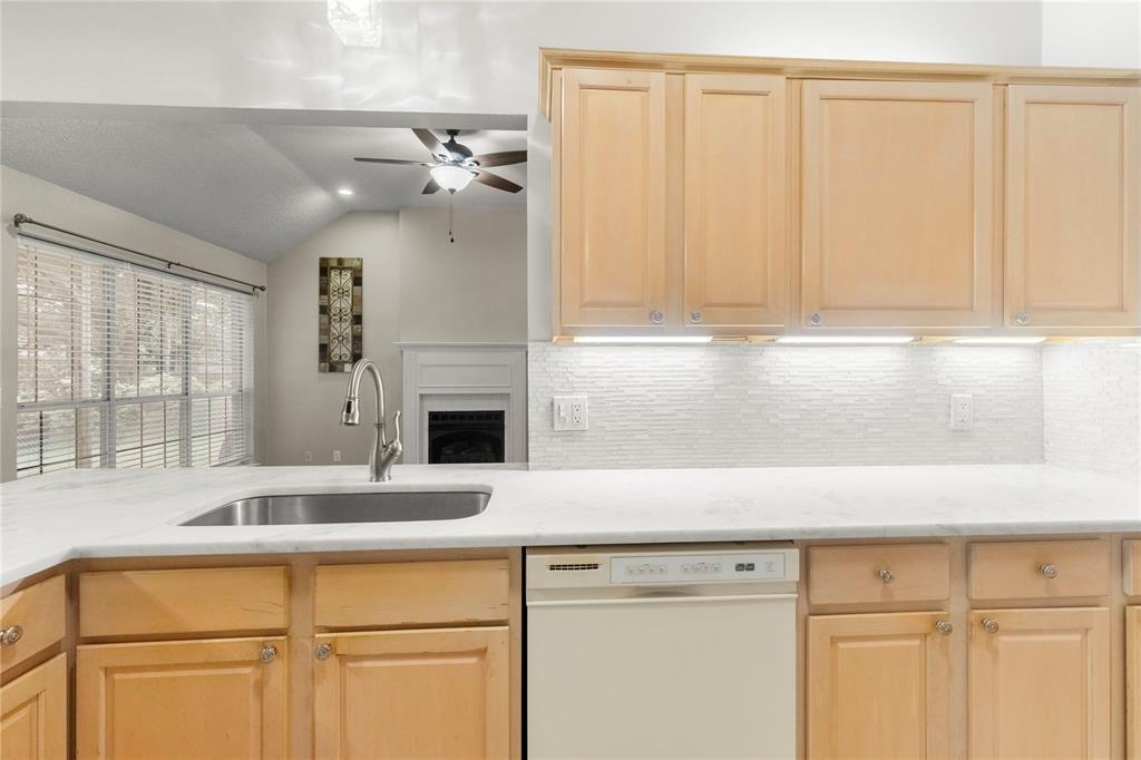 2917 Harlow Road Commerce, TX 75428 - Photo 12 of 40 a kitchen with a sink and a window