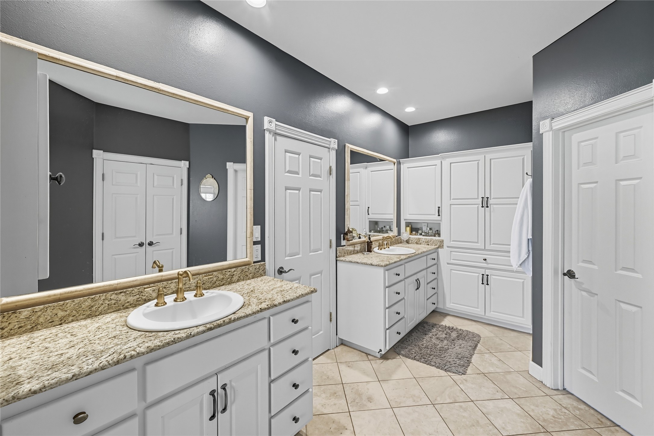 8075 Mt Sharp Road Wimberley, TX 78676 - Photo 16 of 30 a bathroom with a granite countertop sink mirror and