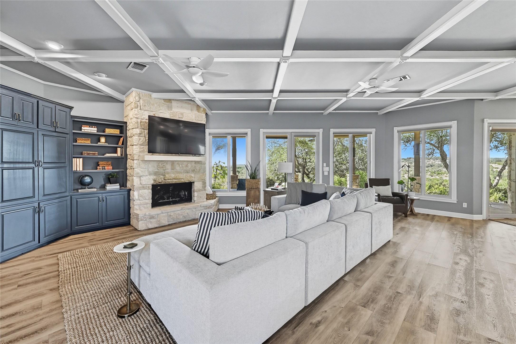 8075 Mt Sharp Road Wimberley, TX 78676 - Photo 30 of 30 a living room with furniture a fireplace and a flat screen tv
