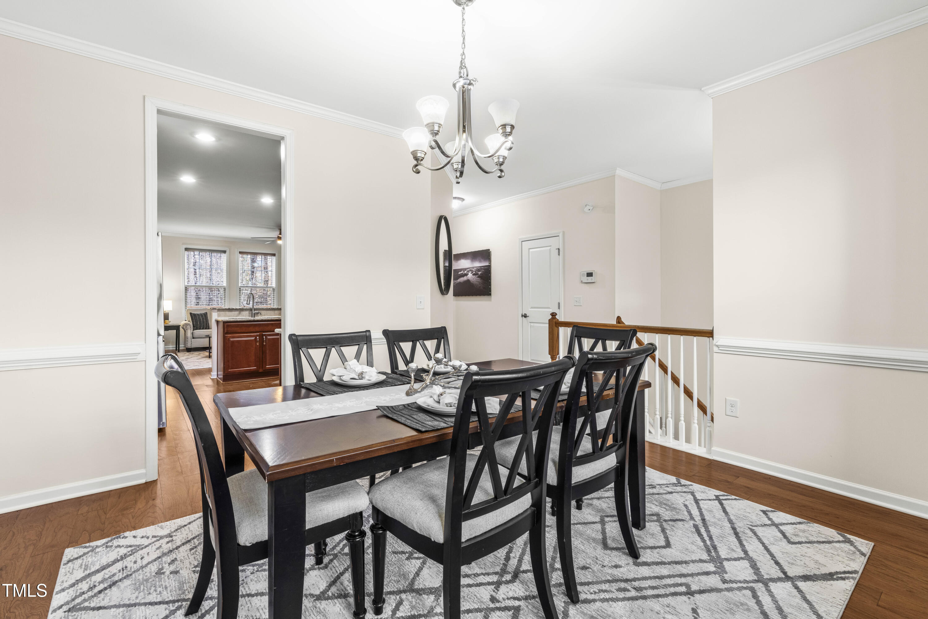 5633 Wade Park Boulevard Raleigh, NC 27607 - Photo 10 of 34 a view of a dining room with furniture and chandelier