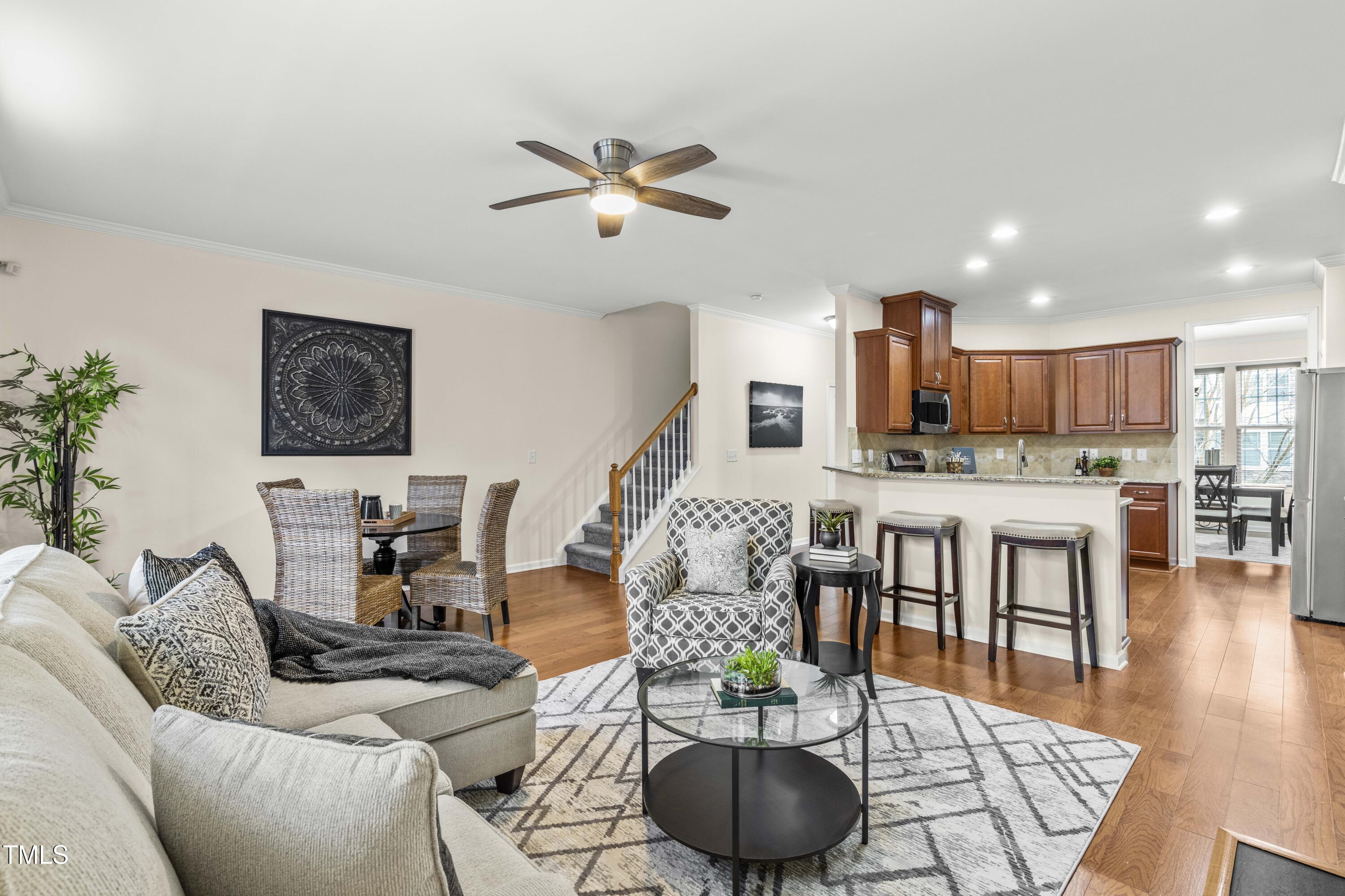 5633 Wade Park Boulevard Raleigh, NC 27607 - Photo 15 of 34 a living room with furniture and kitchen view