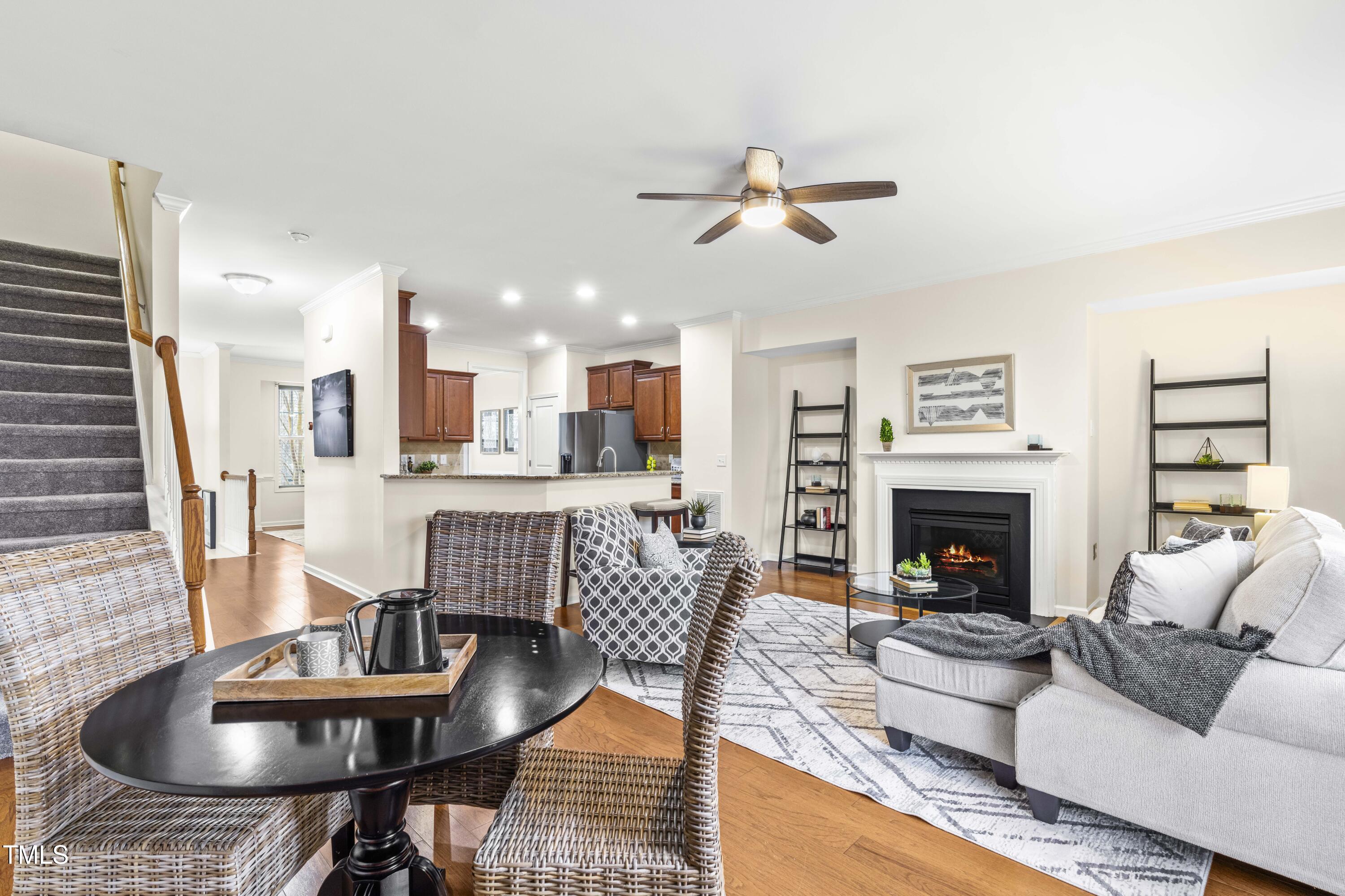 5633 Wade Park Boulevard Raleigh, NC 27607 - Photo 17 of 34 a living room with furniture and a fireplace