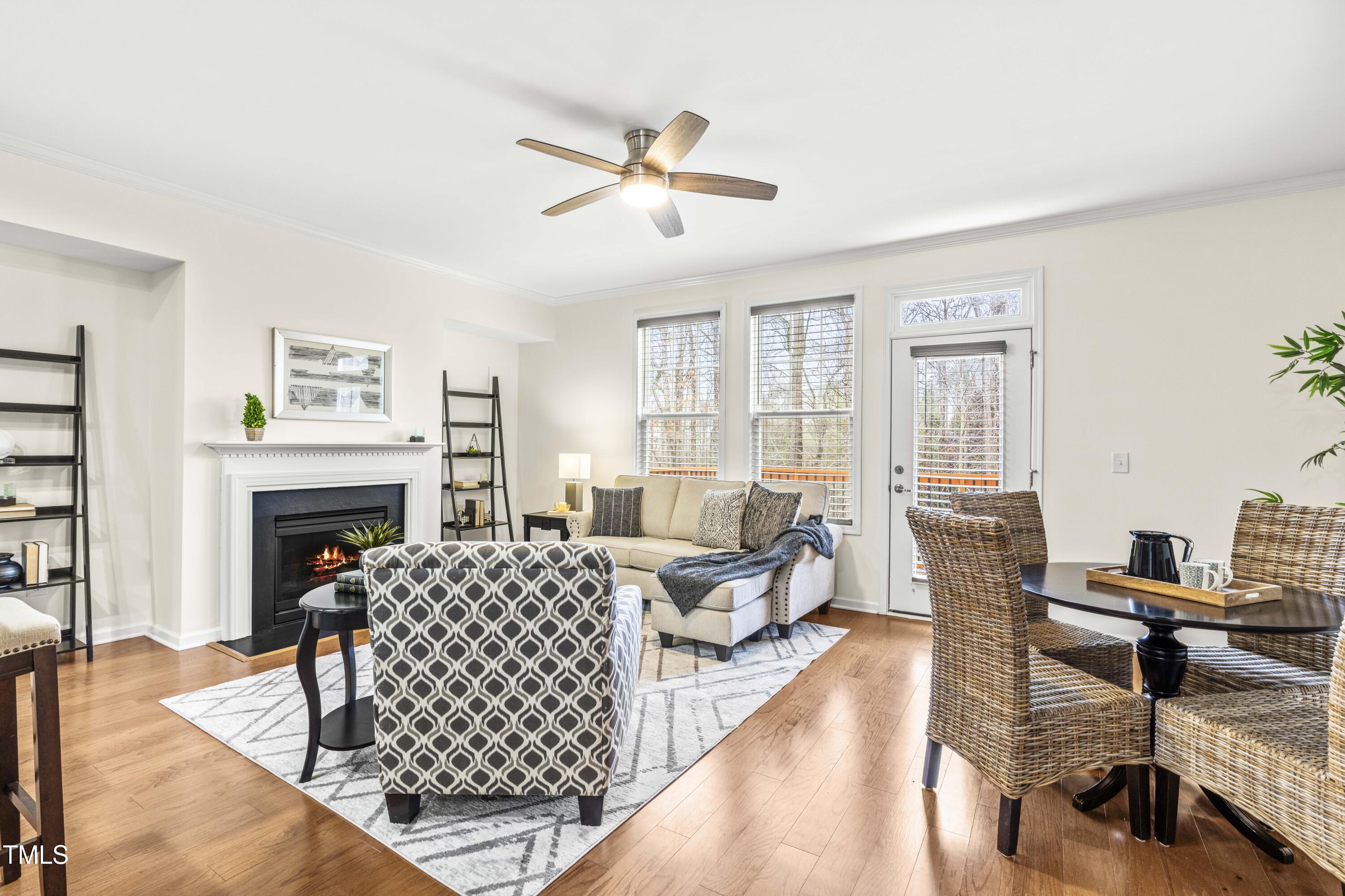 5633 Wade Park Boulevard Raleigh, NC 27607 - Photo 18 of 34 a living room with furniture fireplace and a table