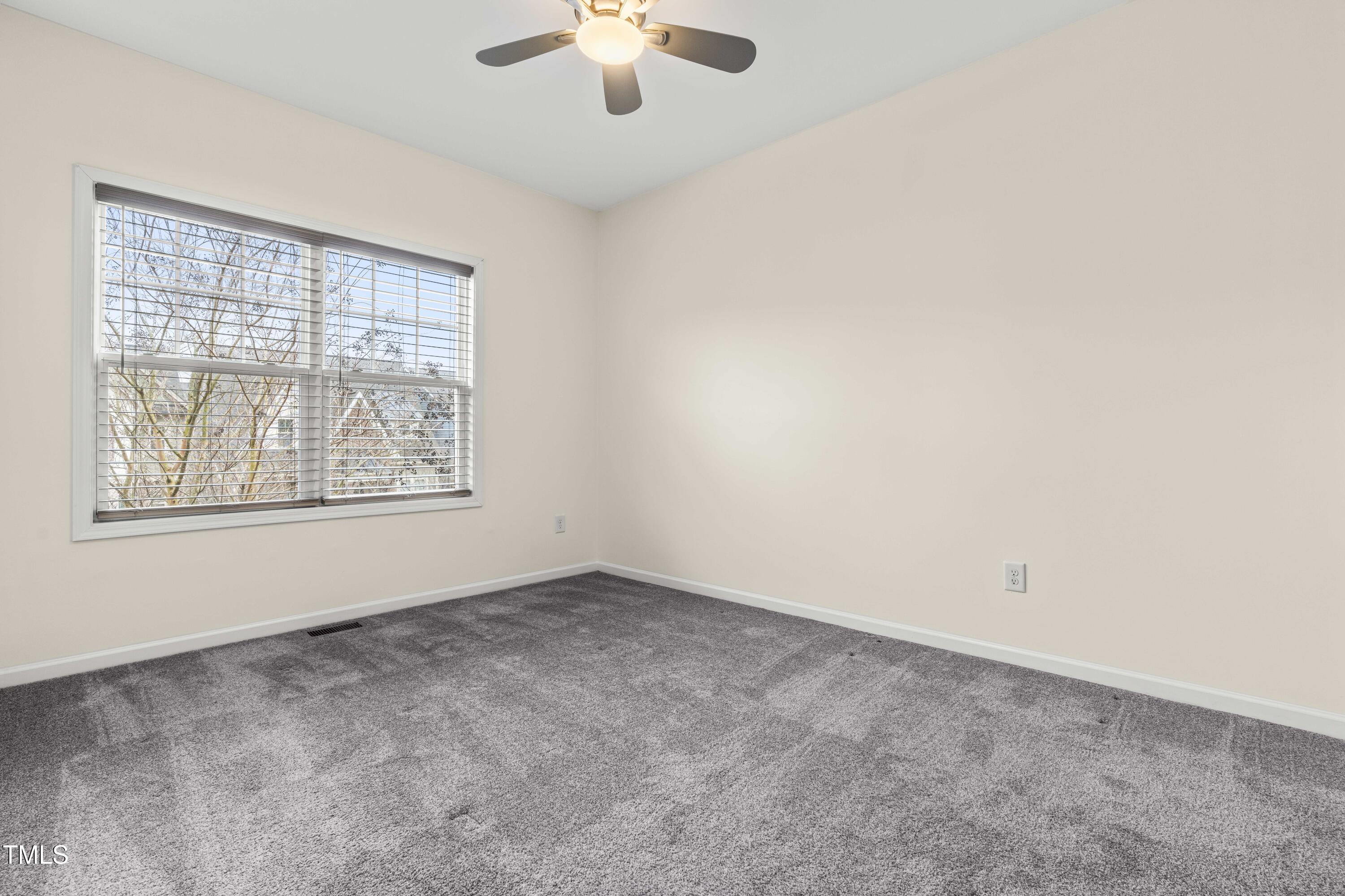 5633 Wade Park Boulevard Raleigh, NC 27607 - Photo 21 of 34 an empty room with a window