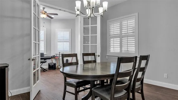 a dining room with furniture and window