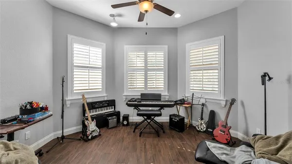 a livingroom with workspace and a window