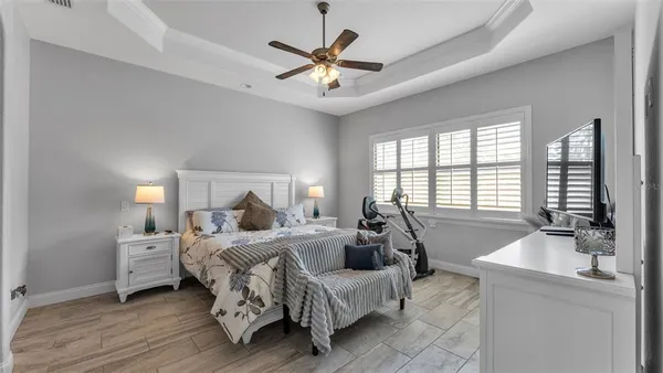 a bed room with a bed and a large window