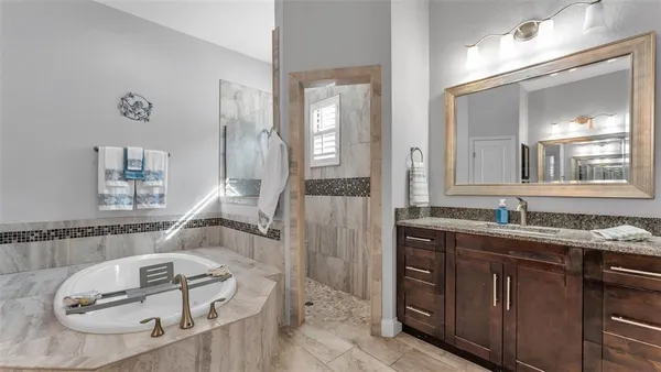 a bathroom with a sink and mirror
