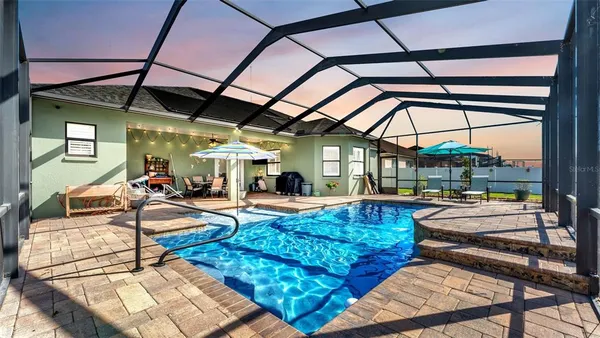 a view of a swimming pool with a patio
