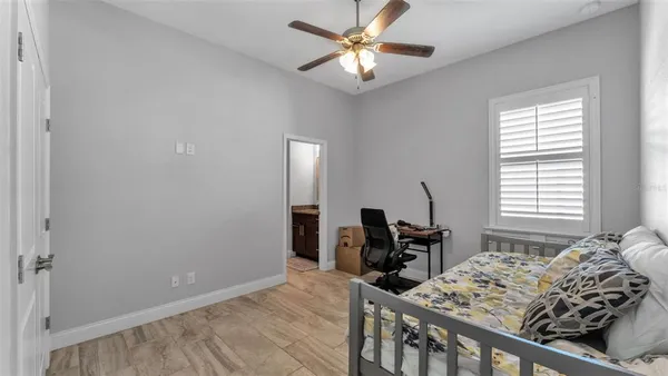 a bedroom with furniture and a window