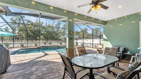 a balcony with table and chairs