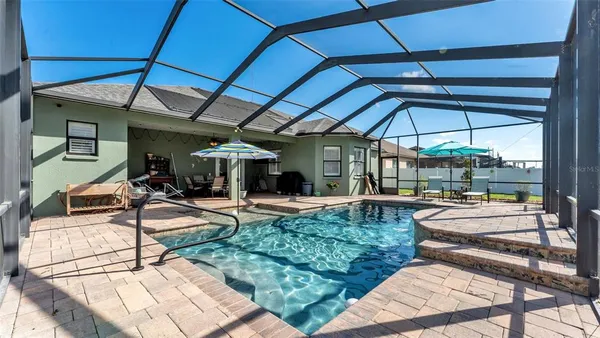 a view of a backyard with sitting area
