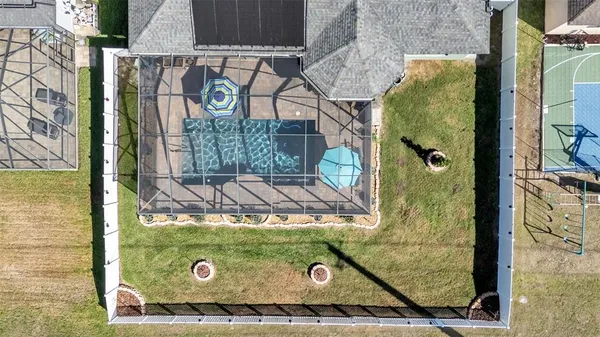 an aerial view of a house with a swimming pool
