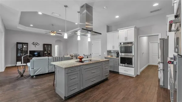 a kitchen with counter top space and stainless steel appliances