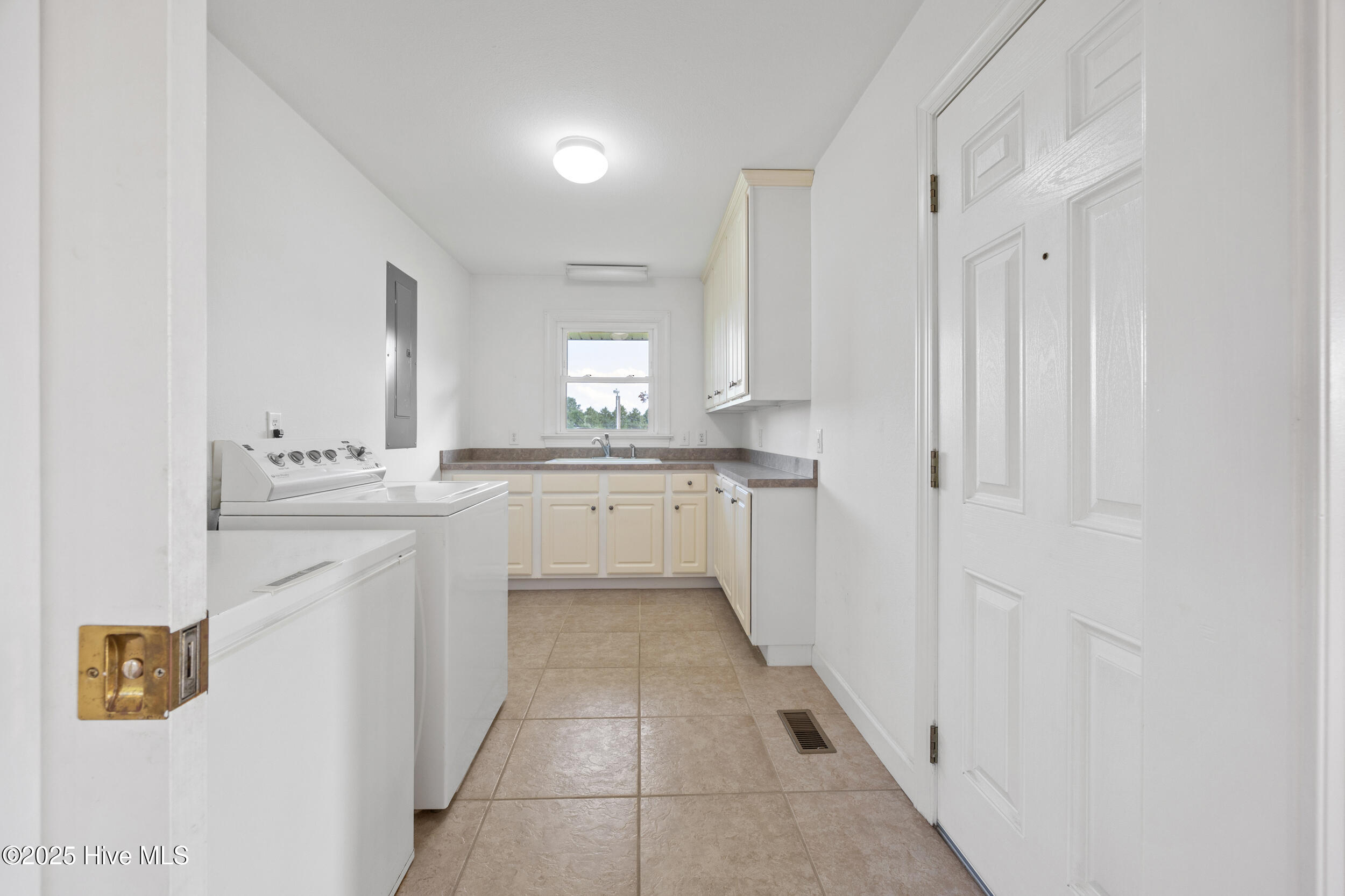 644 Happy Home Road Tyner, NC 27980 - Photo 20 of 28 Oversized laundry room with sink and storage