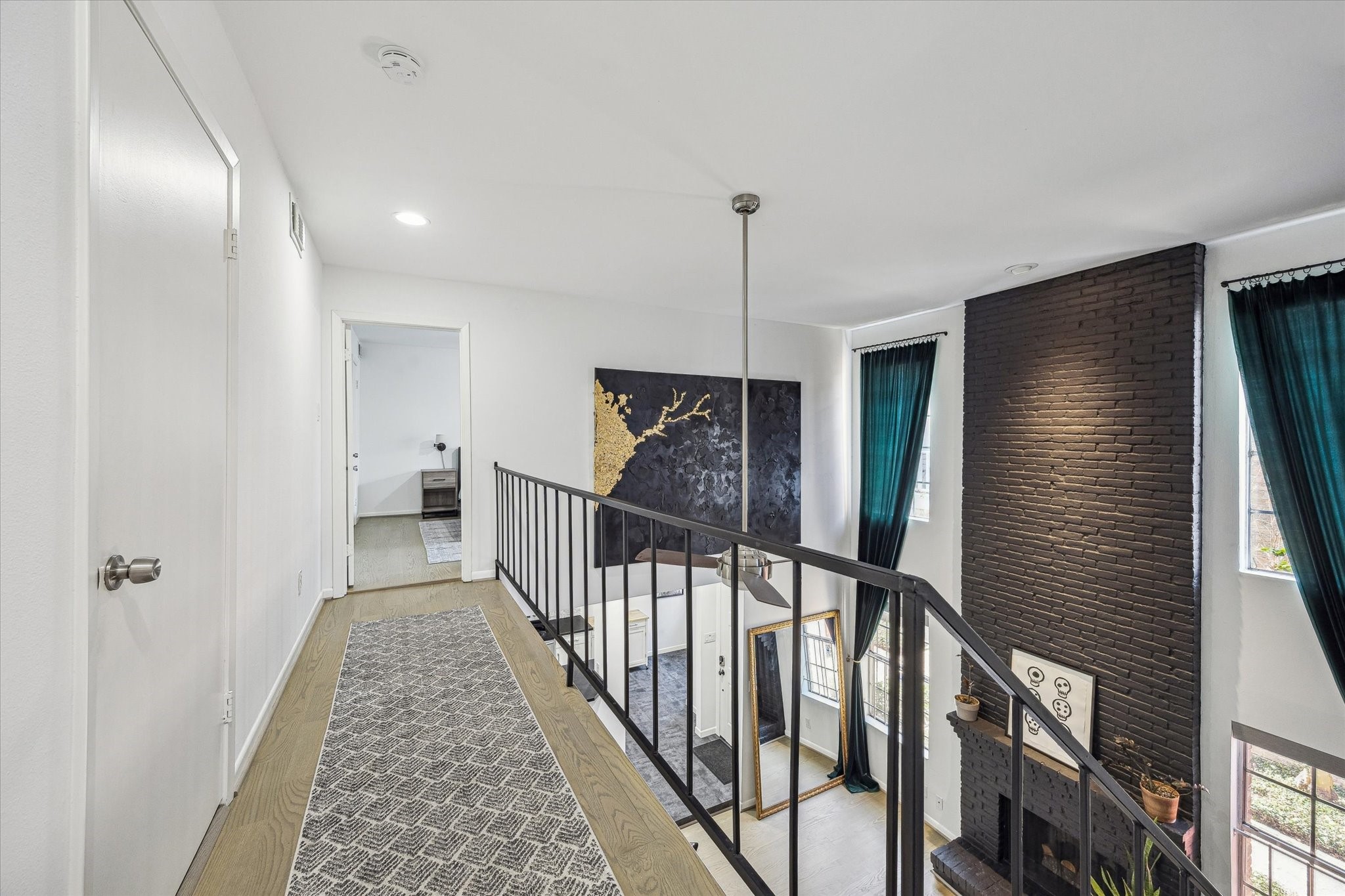 5524 Beverly Hill Street, Unit 2 Houston, TX 77056 - Photo 20 of 29 There is a hallway that separates the two bedrooms.