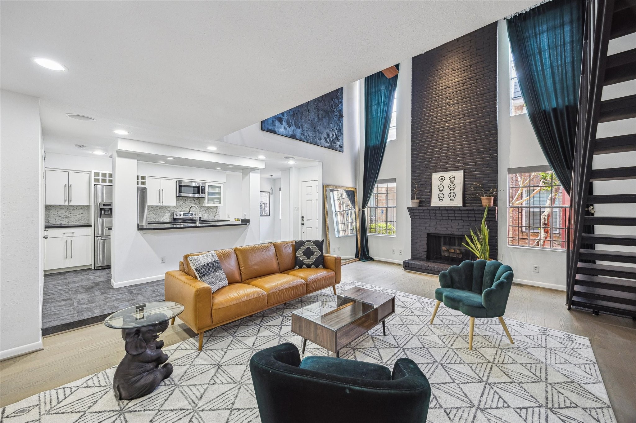 5524 Beverly Hill Street, Unit 2 Houston, TX 77056 - Photo 2 of 29 It's hard to do it justice in photos but the ceilings in the living room are soaring.