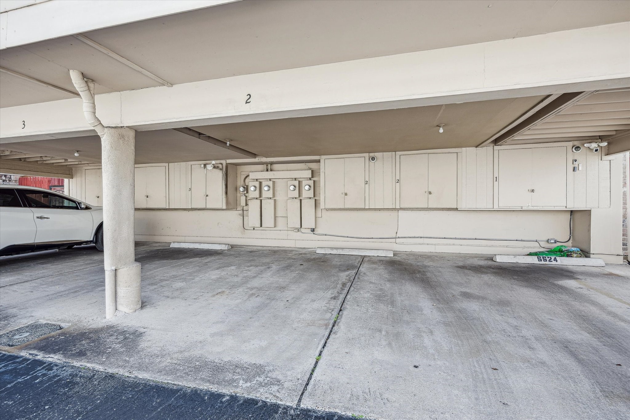 5524 Beverly Hill Street, Unit 2 Houston, TX 77056 - Photo 26 of 29 There is an assigned covered parking spot conveniently located behind the unit.