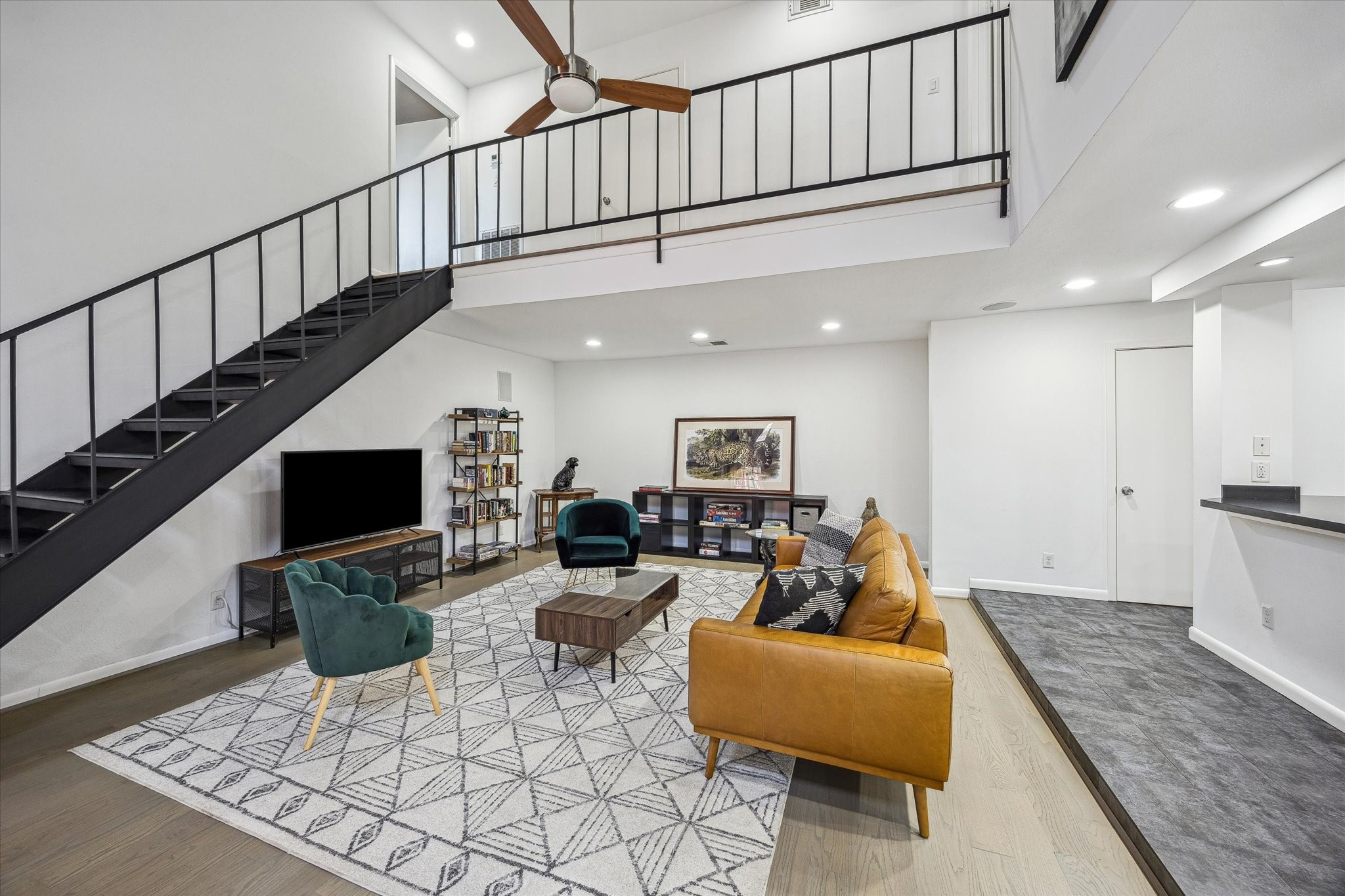 5524 Beverly Hill Street, Unit 2 Houston, TX 77056 - Photo 4 of 29 Stepping inside there is the living room to the left and kitchen to the right.