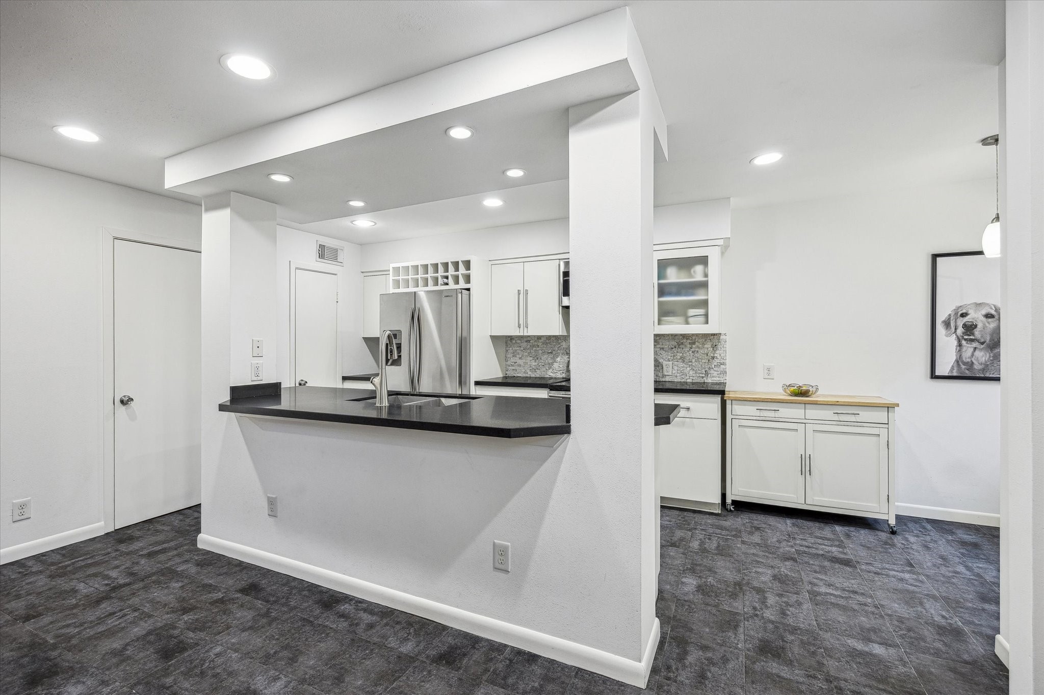 5524 Beverly Hill Street, Unit 2 Houston, TX 77056 - Photo 5 of 29 Updated kitchen with an island open to the living space.