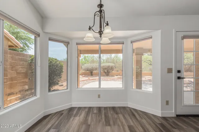 a view of kitchen and kitchen with wooden floor