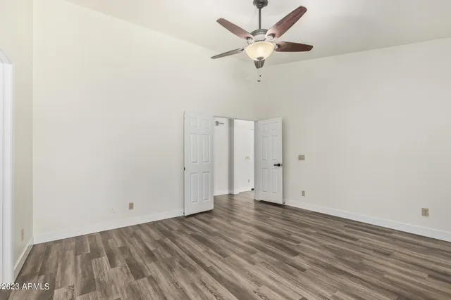 a bathroom with double vanity sinks and a bathtub