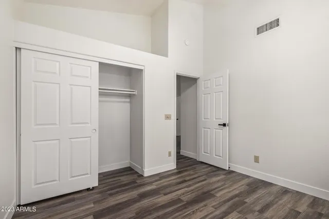 a bathroom with a double vanity sink mirror and toilet