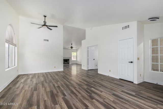 a view of a room with window and hardwood floor