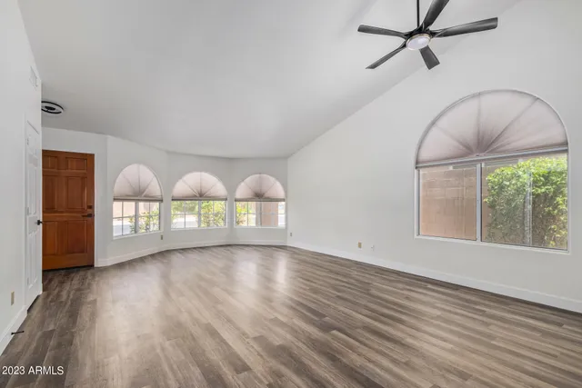 a large kitchen with granite countertop a sink window and stainless steel appliances