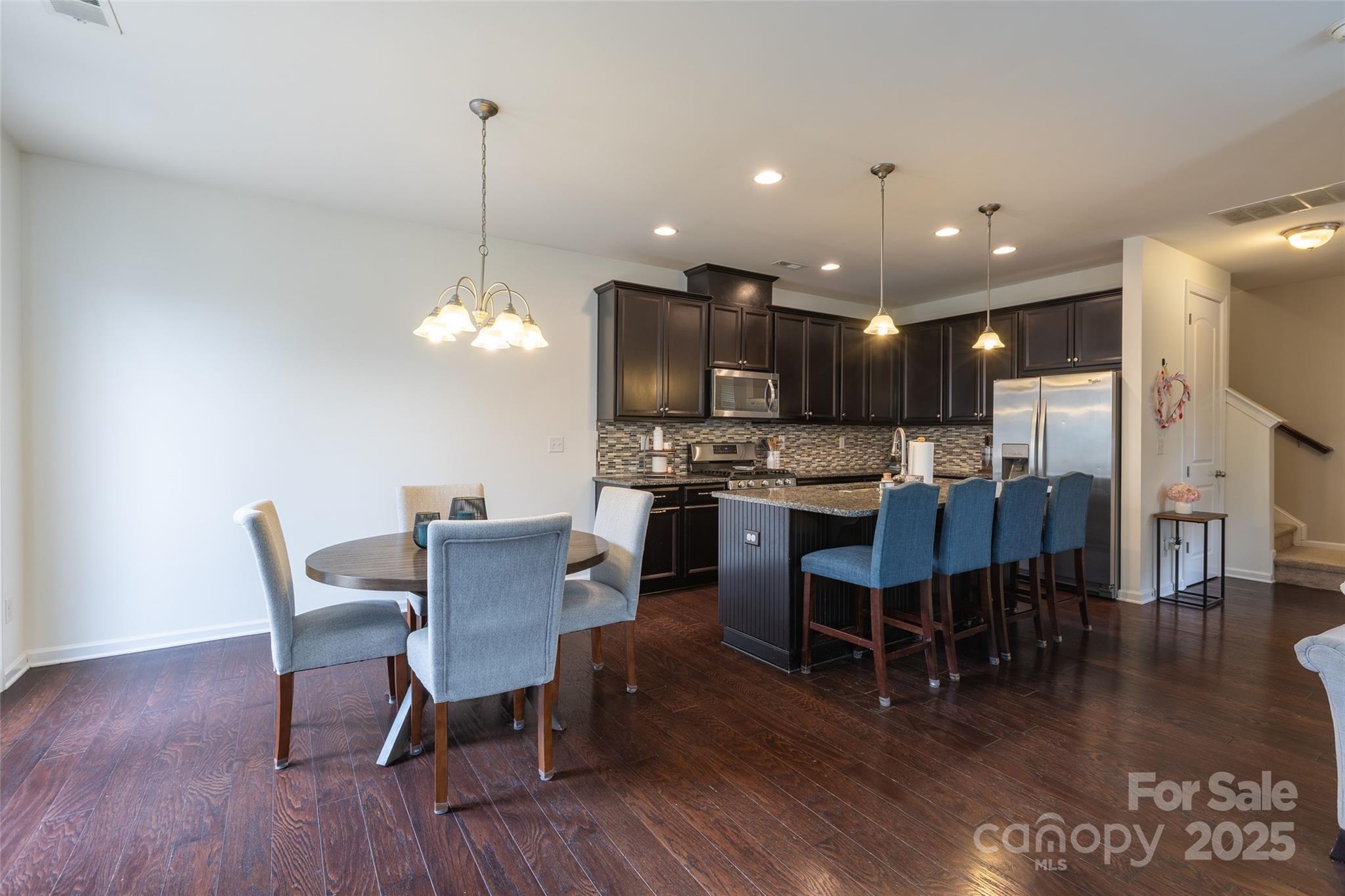 1019 Archibald Avenue Fort Mill, SC 29708 - Photo 11 of 26 a view of a dining room with furniture and wooden floor