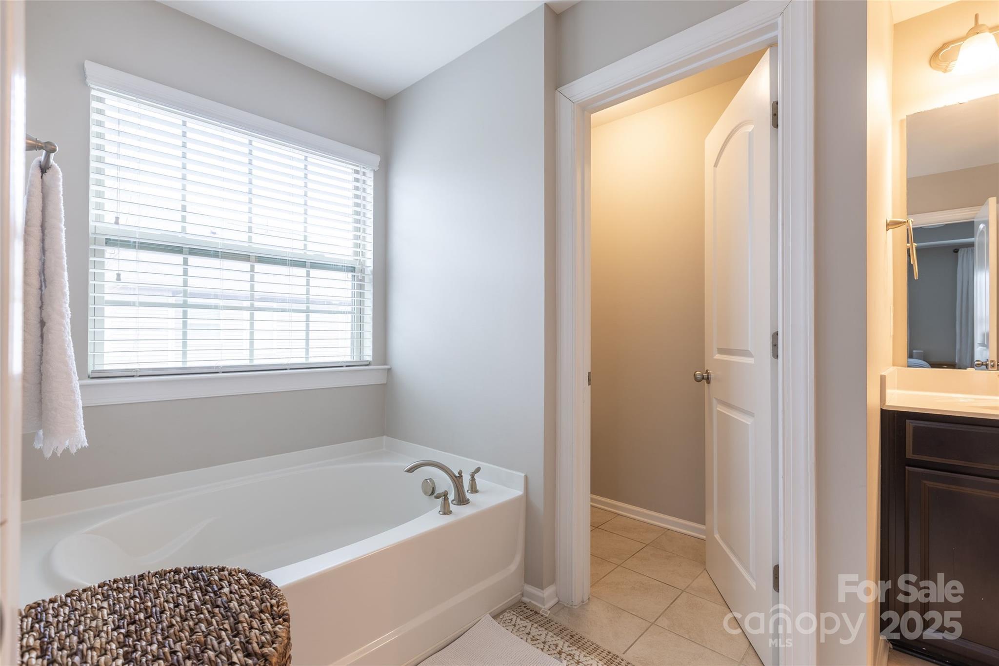 1019 Archibald Avenue Fort Mill, SC 29708 - Photo 16 of 26 a bathroom with a bathtub and a shower