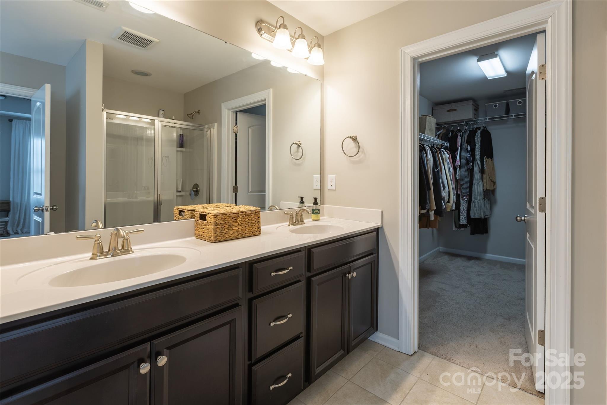 1019 Archibald Avenue Fort Mill, SC 29708 - Photo 17 of 26 a bathroom with a double vanity sink and a mirror