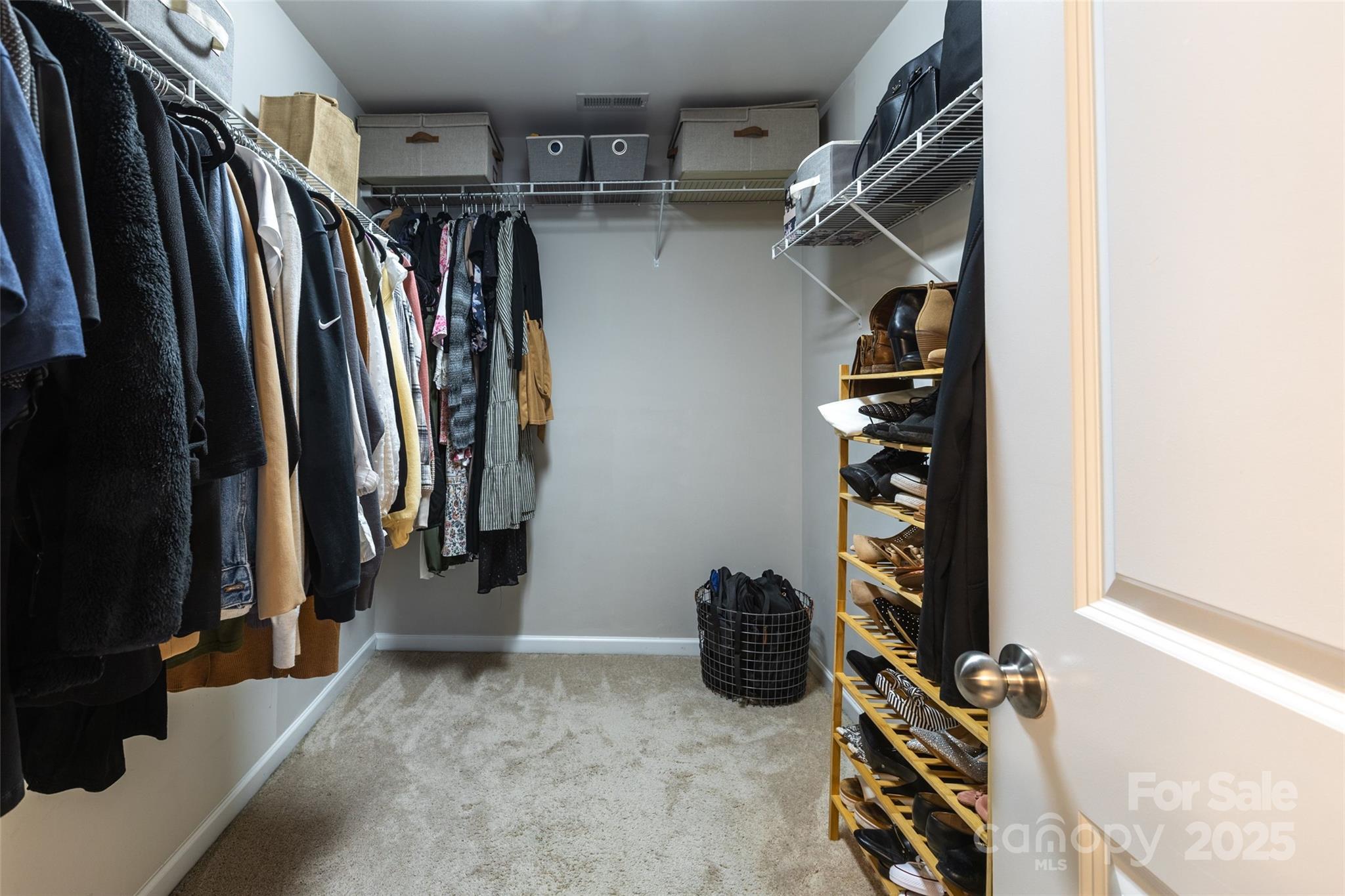 1019 Archibald Avenue Fort Mill, SC 29708 - Photo 18 of 26 a view of walk in closet with clothes and shoes