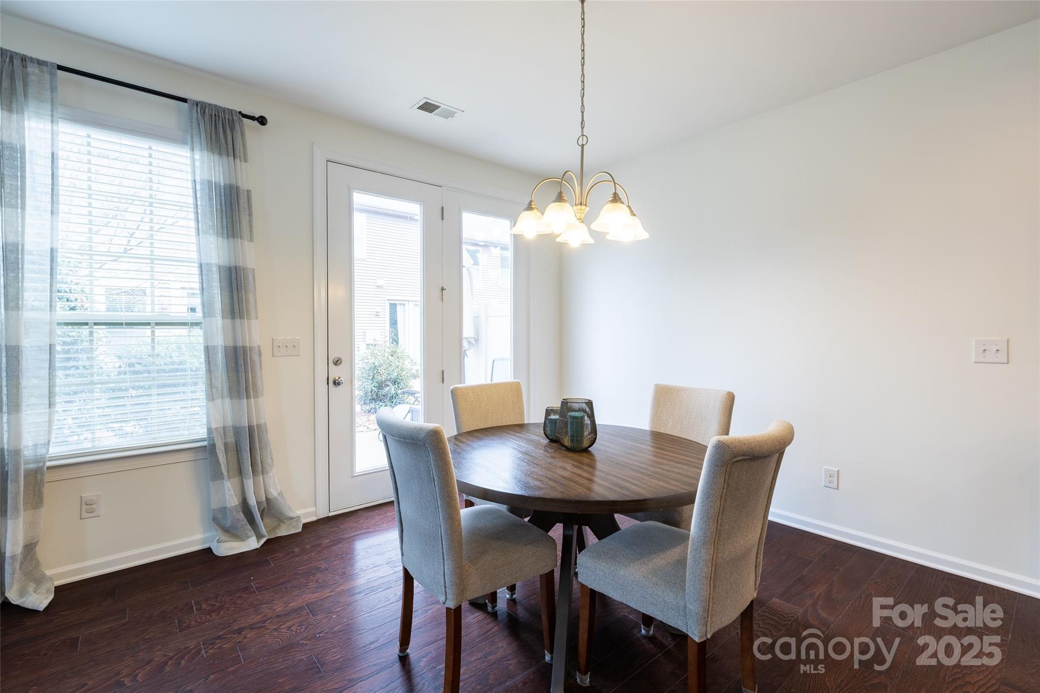 1019 Archibald Avenue Fort Mill, SC 29708 - Photo 10 of 26 a view of a dining room with furniture window and wooden floor