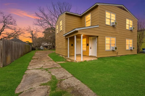 a front view of a house with a yard