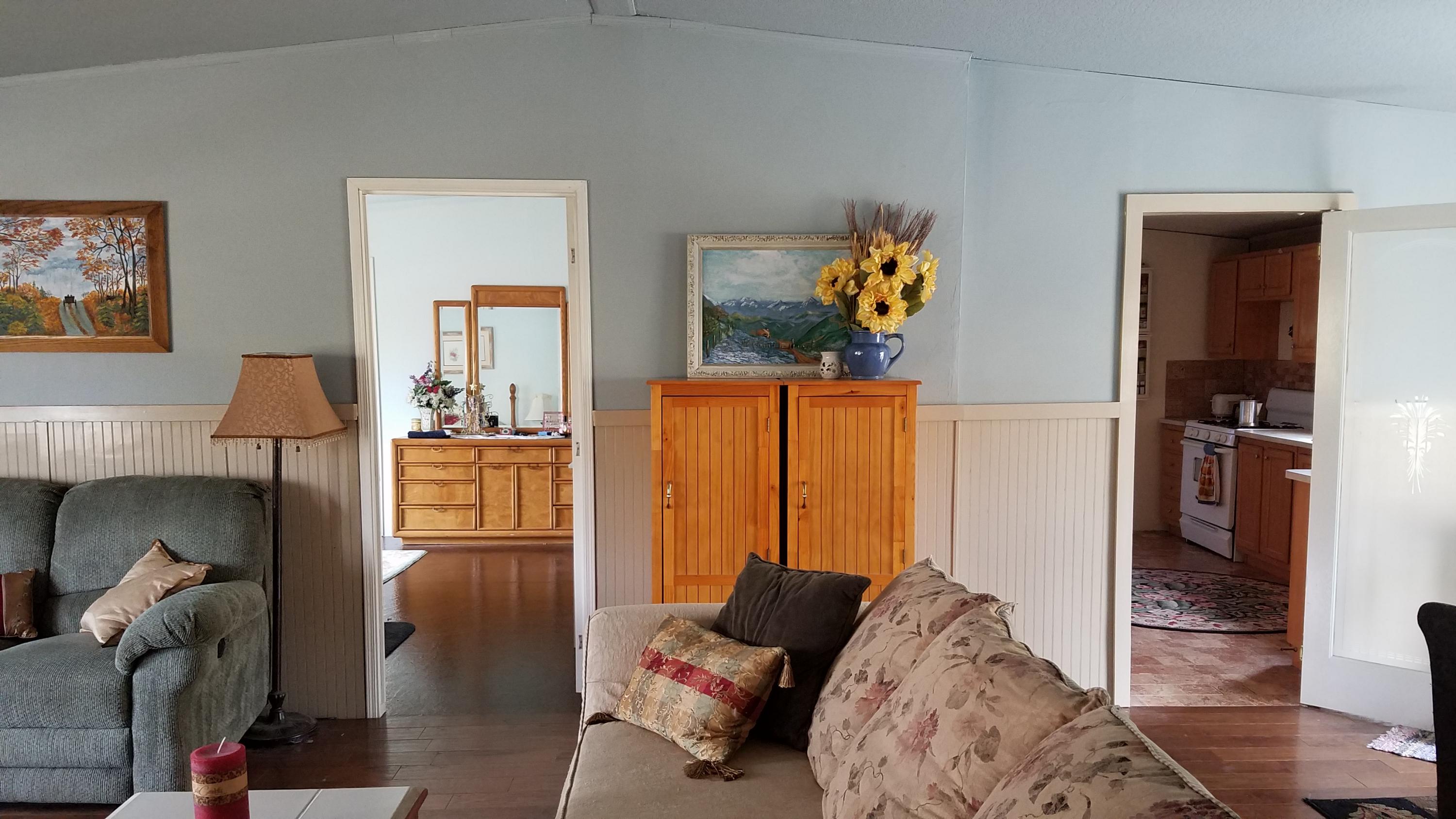 17215 Tehachapi Willow Springs Road Tehachapi, CA 93561 - Photo 15 of 45 a living room with furniture and a wooden floor