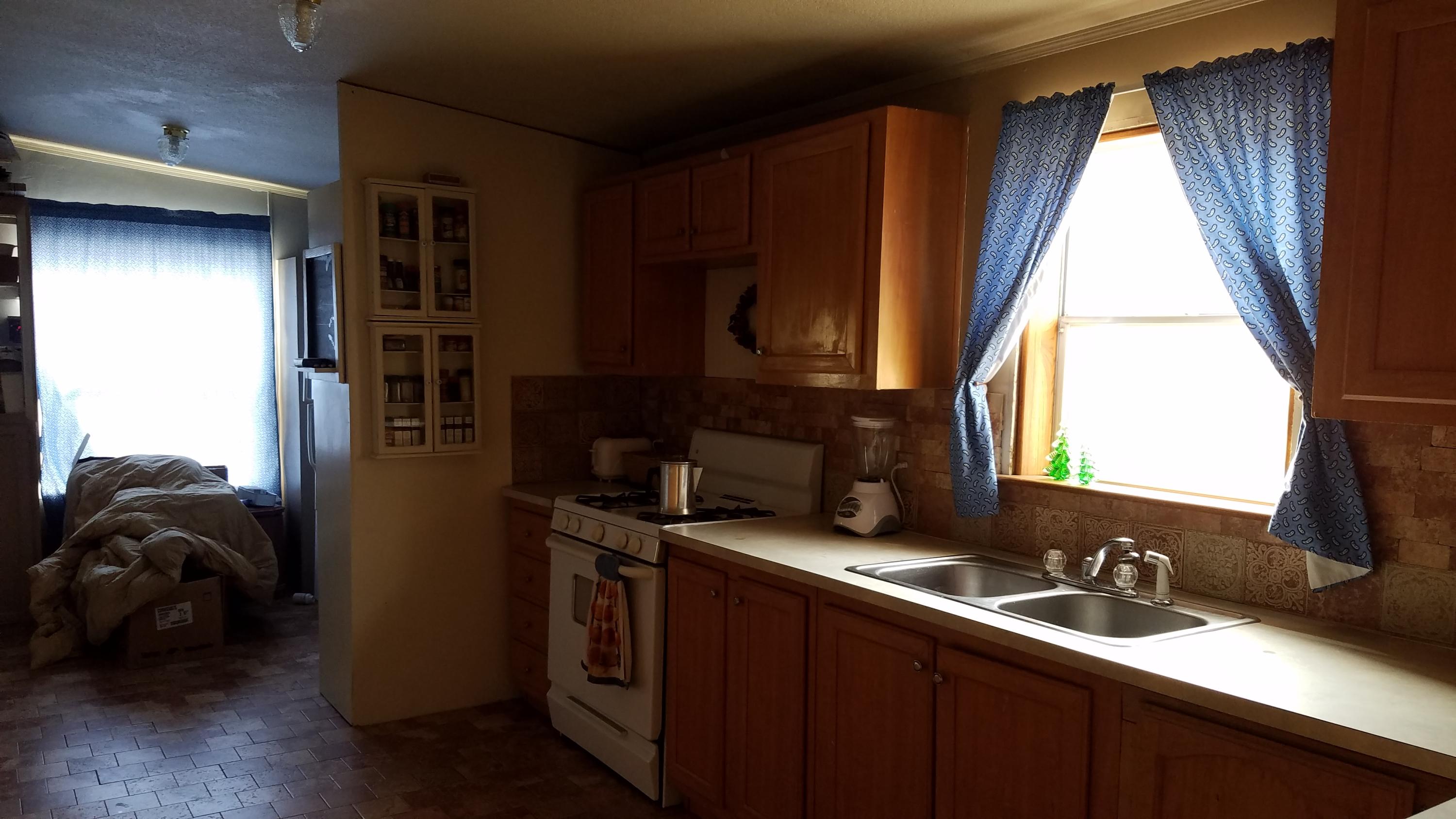 17215 Tehachapi Willow Springs Road Tehachapi, CA 93561 - Photo 18 of 45 a bathroom with a sink a mirror and a window