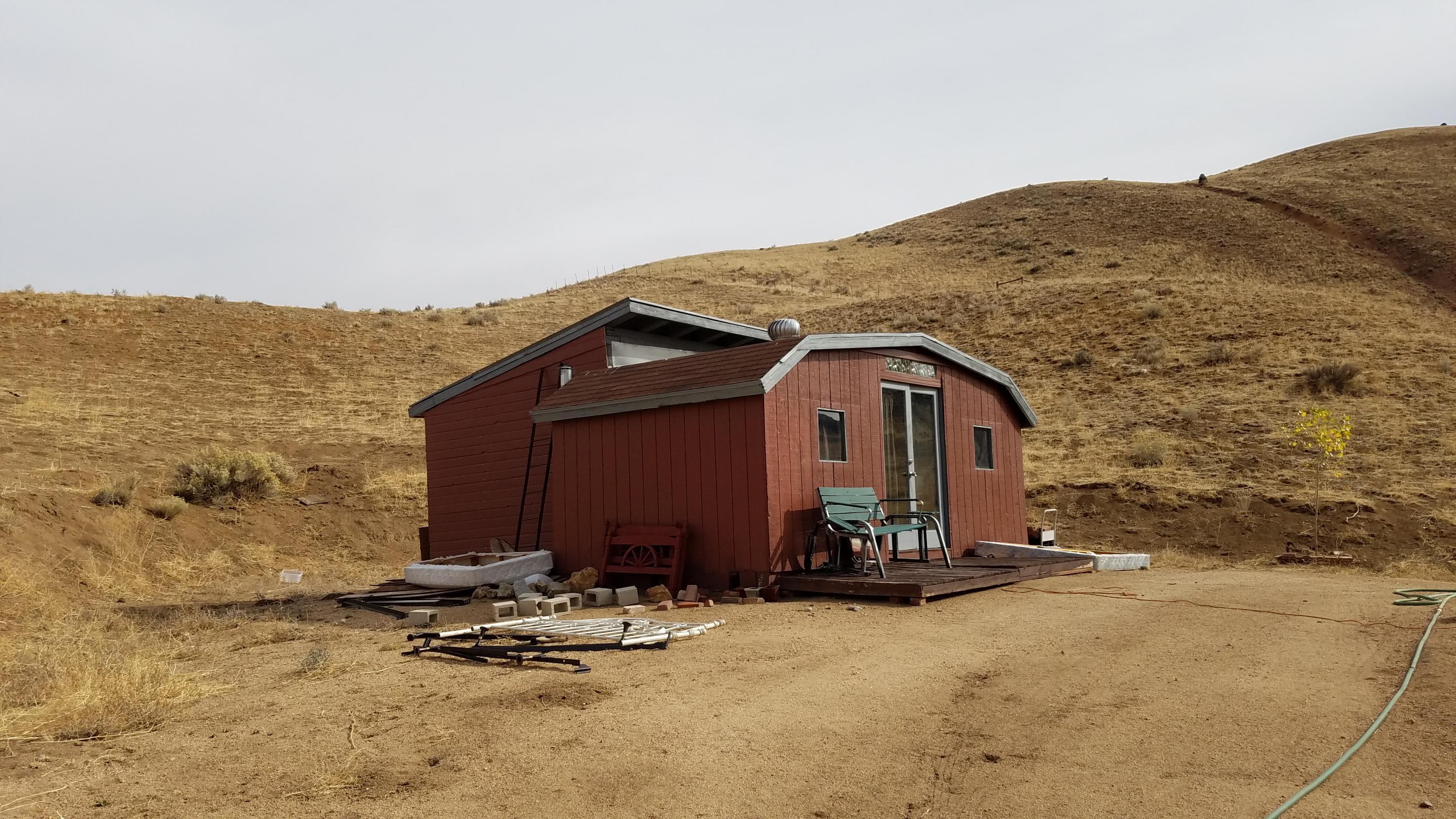 17215 Tehachapi Willow Springs Road Tehachapi, CA 93561 - Photo 39 of 45 a front view of a house with a yard