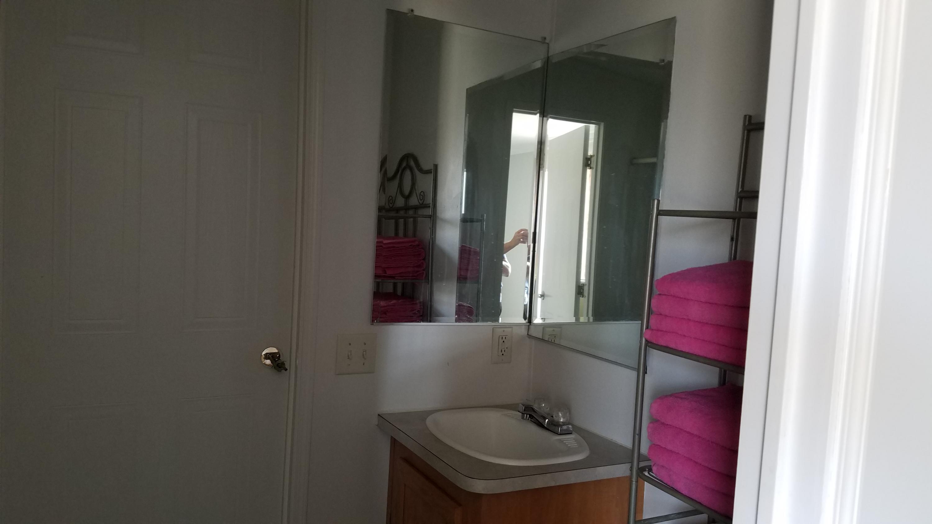 17215 Tehachapi Willow Springs Road Tehachapi, CA 93561 - Photo 8 of 45 a bathroom with a toilet and a mirror