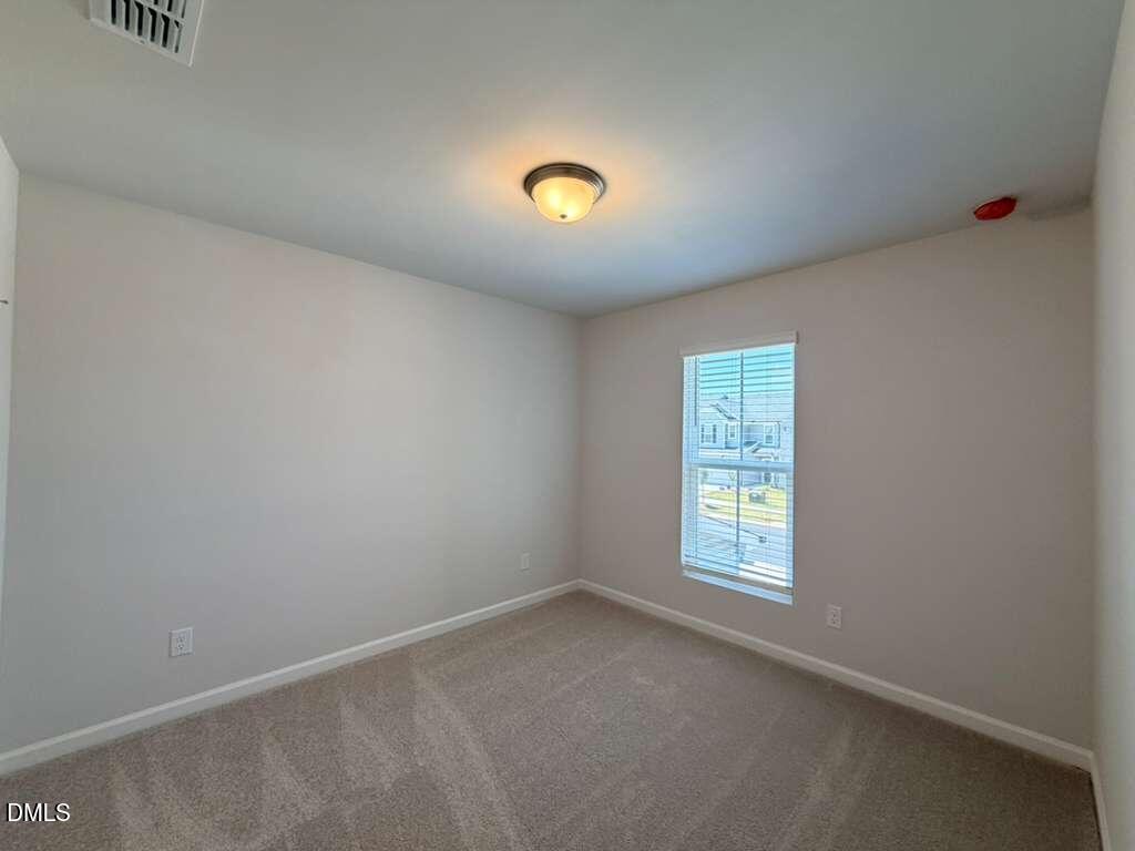 5024 Reader Way Durham, NC 27703 - Photo 23 of 26 an empty room with windows
